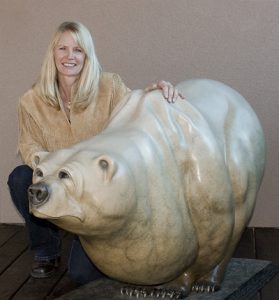 Kim Chavez with Bronze Bear Sculpture